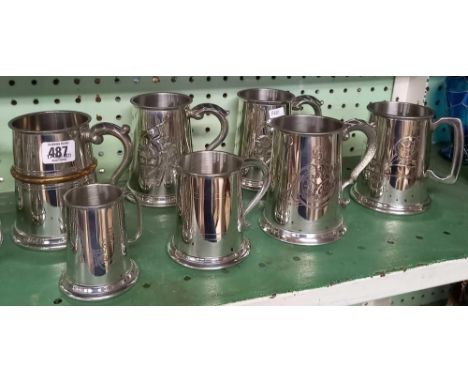 SHELF OF PLATED TANKARDS