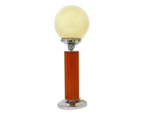 An Art Deco table lamp, with a glass globe shade, chrome mounts and a reeded Bakelite column, 42cm high