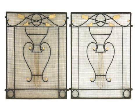 A pair of wrought iron panels, with a harp design beneath crossed arrows, with nine panels, 66cm wide 78cm high (2)