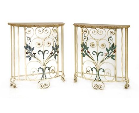 A pair of Art Deco marble and wrought iron console tables, of demilune form, the stands painted with scrollwork and intertwin