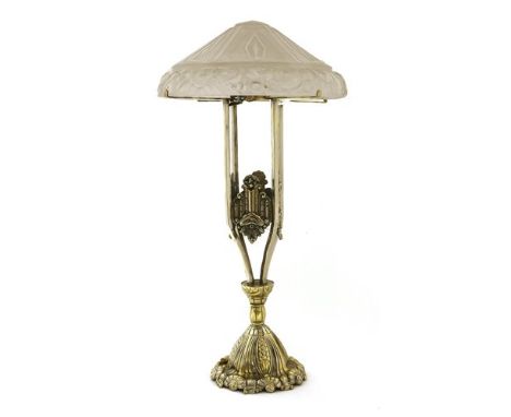 An Art Deco cast lamp, with a moulded glass shade on a brass and silvered cast stand, 57cm high