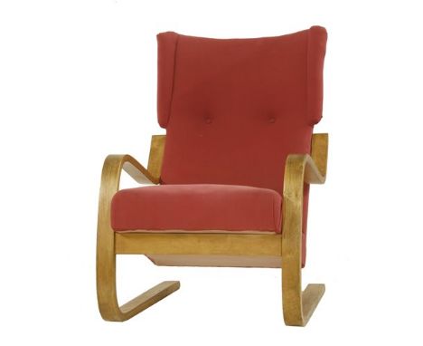A model 401 lounge armchair, designed by Alvar Aalto in 1933, with red upholstery, 62cm wide 80cm deep 89cm high
