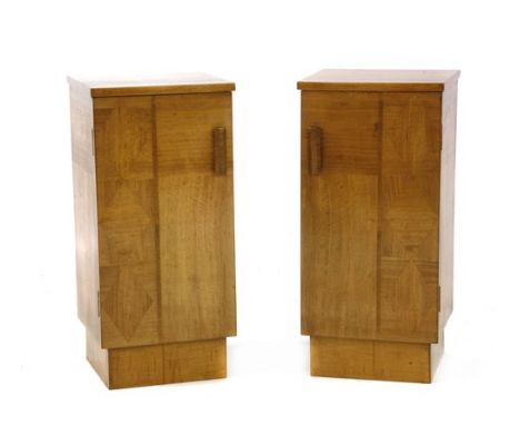 A pair of Art Deco walnut and sycamore bedside cupboards, each with parquetry fronts opening to reveal a shelf, with cylindri