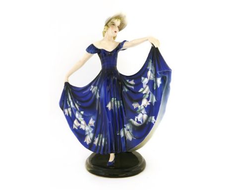 A Goldscheider figure of a lady in a blue dress, by Stephan Dakon, no. 7257, stamped and printed marks, 31cm high Provenance: