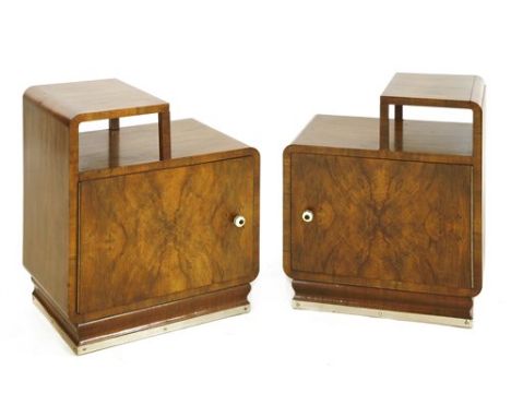 A pair of Art Deco walnut bedside chests, each with a shelf over a cupboard, 50cm wide 35cm deep 58.5cm high (2)