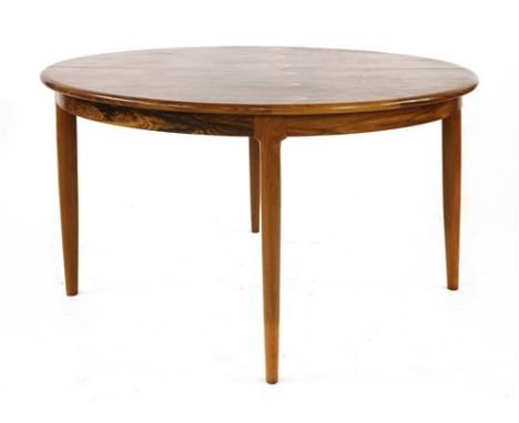 A rosewood dining room suite, §&nbsp;designed by Niels Otto Møller for J L Møller, comprising:an extending dining table,&nbsp