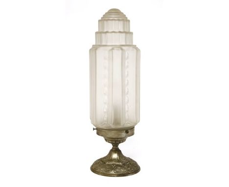 A French Art Deco table lamp, with a frosted glass shade, mounted on a cast plinth, 45cm high
