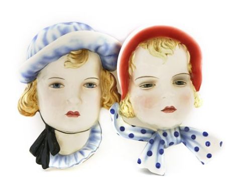 Two Goldscheider pottery wall masks, nos. 7409 and 7291, of young girls, stamped incised and printed marks, 23cm high (2) Pro