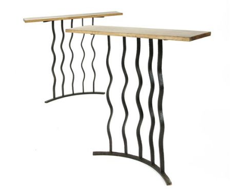 A pair of wrought iron console tables, with limed oak tops, 90cm wide 20cm deep 78cm high (2)