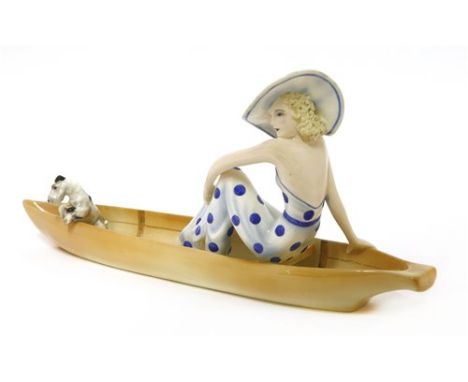 A Goldscheider figure of a woman sitting in a boat with a terrier, by Stephan Dakon, no. 7256, stamped and printed marks, res