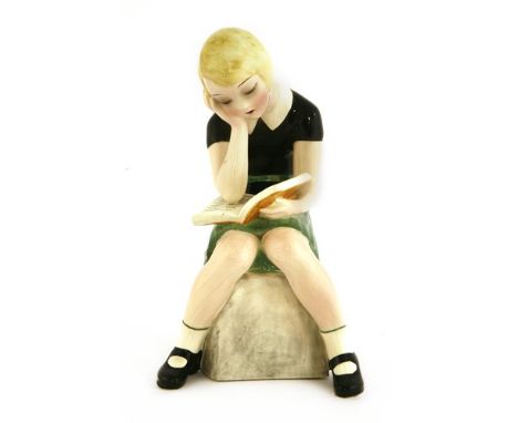 A Goldscheider figure of a girl reading a book, by Claire Weiss (b.1906), no. 6769, incised on the plinth 'Claire Weiss', sta