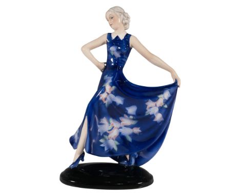 Art Deco figure of a woman in a long blue floral dress. Artist signed. Marked: Goldscheider backstamp and 7454 / 215 / 31. Ar