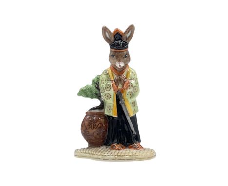 A hand made and hand decorated, green and black special colorway edition of 100, features a glossy porcelain bunny fashioned 