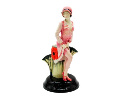 Limited edition figure lady in pink exposing her stocking. On a black base with a Clarice Cliff inspired pedestal. Kevin Fran