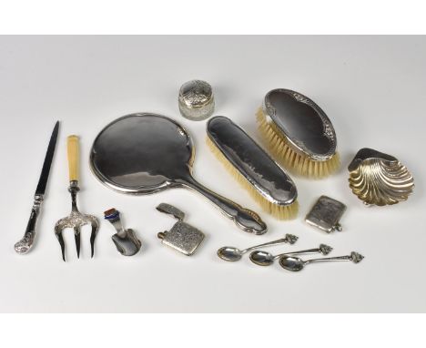 A miscellaneous group of silver collectables vesta case; lighter; dressing table set; caddy spoon; paperknife etc etc.