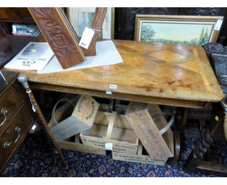 An early Victorian walnut and satinwood parquetry centre table the rounded rectangular, cross banded top with diamond parquet