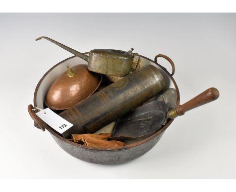An enamelled iron twin handled jam or preserve pan together with a vintage oil can, leather pouch of vintage tools, coal shov