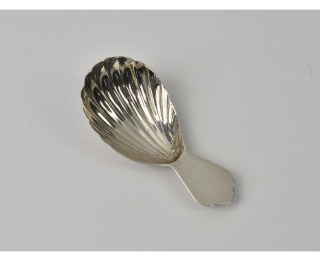 A George III silver scallop shell caddy spoonmaker's mark CH, London 1791, with trefid style handle, 3in. (7.6cm.) long, weig