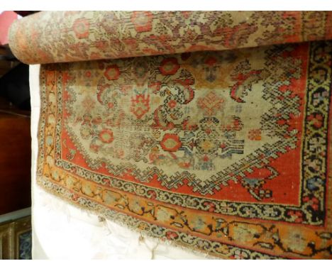 A Turkish style runner with all over geometric decoration in reds, orange, blue and buff with multiple borders 154 x 40in (39