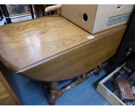 A vintage Ercol drop leaf gateleg table.