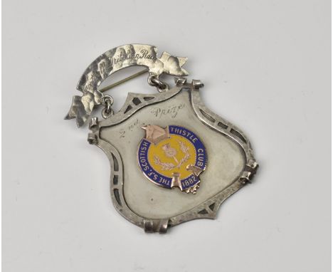 A Scottish Thistle Club silver football medal the observe with enamel badge to centre, inscribed football dribbling race, 2nd