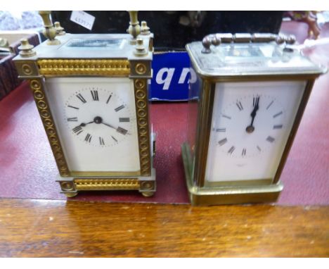 A Jersey brass carriage clock together with another with ornate decoration (2)