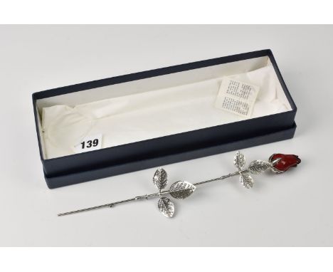 A silver &amp; enamel rose retailed by Aurum, Jersey, stamped 925, comes with original box.