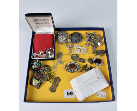 A quantity of various silver &amp; costume jewellery to include a silver charm bracelet; brooches; SOS Talisman; Guernsey Mot