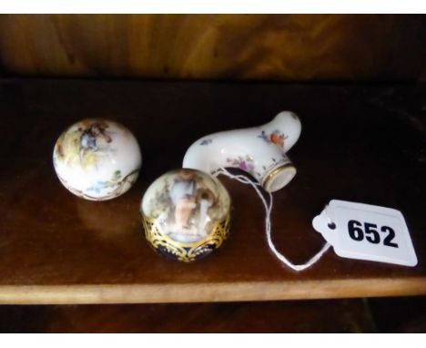 Three antique porcelain walking cane or parasol handles in the Meissen and Sevres styles, comprising a porcelain twist handle