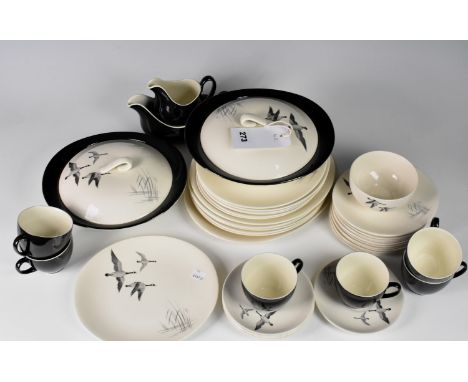 A 1950s Johnson Bros. Flying Geese pattern part dinner service comprising two covered vegetable dishes, an oval platter, six 