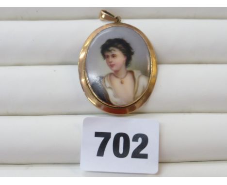 A late Victorian / Edwardian 9ct rose gold mounted hand painted porcelain portrait pendant