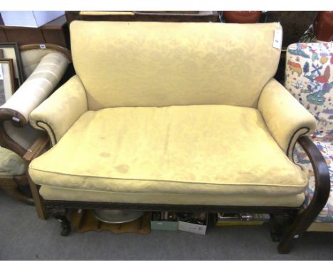 A late Victorian carved mahogany sofa.