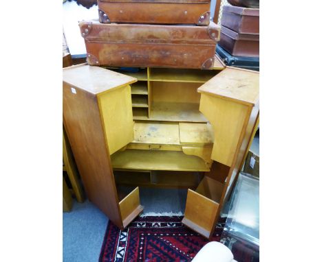 A vintage retro teak student bureau/work station the cabinet doors opening to reveal pull-out desk/drawers, multi compartment