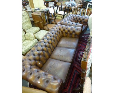 A brown Chesterfield sofa with matching Chesterfield armchair (2)