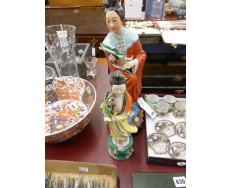 Two Chinese porcelain figures of Guanyin second quarter 20th century, one with orange and yellow robe, holding a lotus leaf a