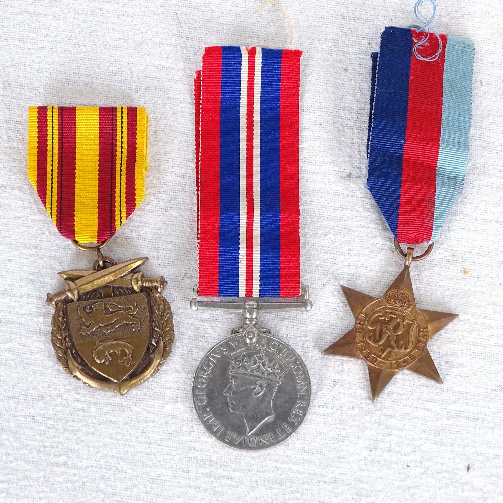 A Dunkirk 1940 medal, a 1939-45 Star medal, and 1939-45 General Service ...