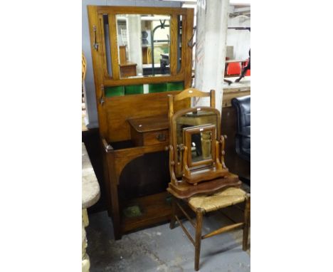 An Edwardian oak mirror-back hallstand, 2 swing toilet mirrors, and a ladder-back chair 