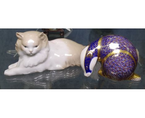 A Royal Crown Derby badger paperweight, and a NAO Persian cat, length 25.5cm 