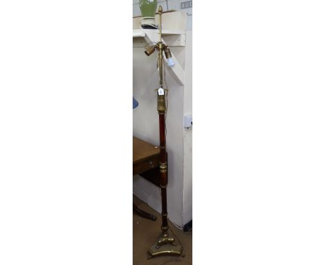 A brass and fluted standard lamp 