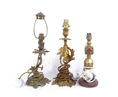 A brass and copper table lamp on oak plinth, height 30cm overall, and a cast-gilt metal lamp, and a brass lamp 