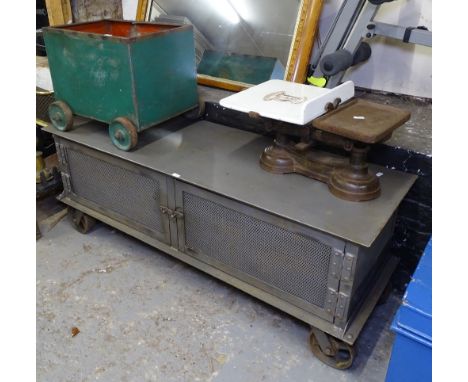 An industrial Steam Punk metal trolley with 2 doors, L120cm, a pair of balance scales, and a small 4-wheel metal box on wheel