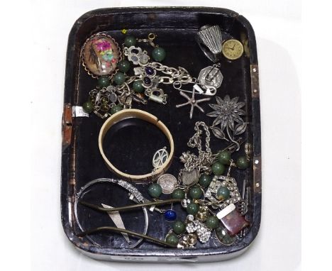 A collection of silver costume jewellery, to include a cubic zirconia set bangle, a filigree brooch etc 