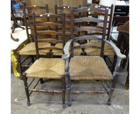A set of 5 1920s oak ladder back dining chairs, with rush seats, comprising 4 standard and 1 elbow chair 