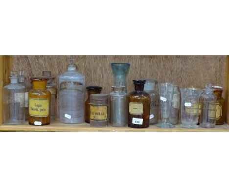 A shelf of Antique chemist's jars, measures etc, tallest 24cm 