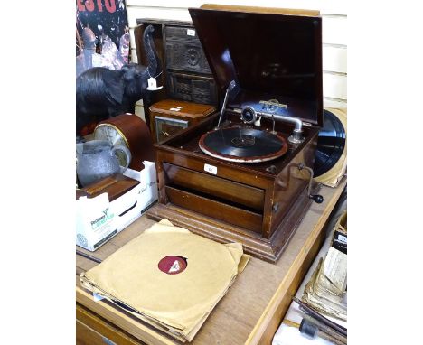 A Columbia mahogany-cased wind-up gramophone, with speaker shutters, and a selection of records, length 49cm 