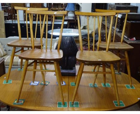 A set of 4 Vintage Ercol elm-seated stick-back chairs 