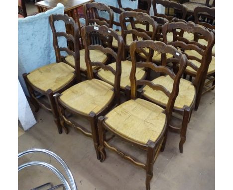 A set of 12 French beech ladder-back and rush-seated dining chairs 