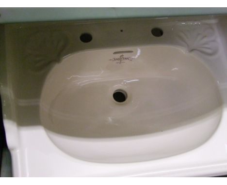 A Sanitan branded wash basin: 