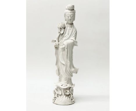 A Chinese, Late Qing Dynasty blanc de chine Guanyin statue. C.1900. 42cm