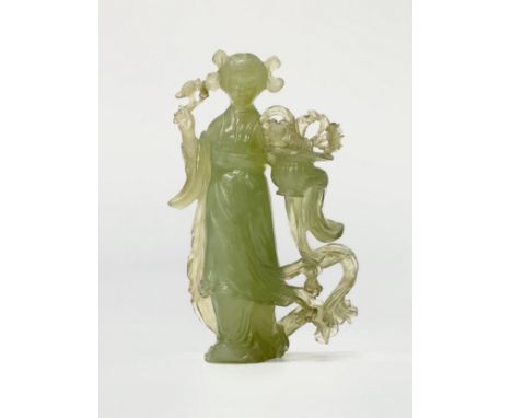 A Chinese carved jade Guanyin statue. Late Qing Dynasty/Early Republic. Early 20th Century. 15.5cm.